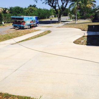 concrete driveway cleaned with pressure washer